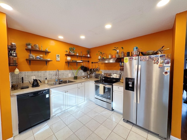 kitchen featuring stainless steel appliances, light countertops, a sink, and open shelves