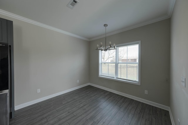 empty room featuring baseboards, visible vents, dark wood-type flooring, and crown molding