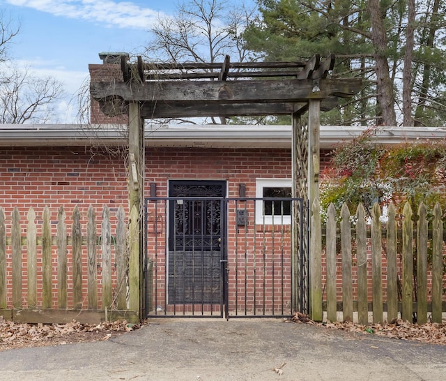 view of gate with fence