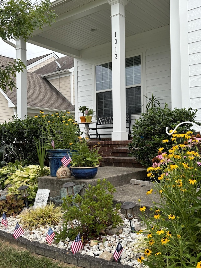 view of exterior entry featuring a porch