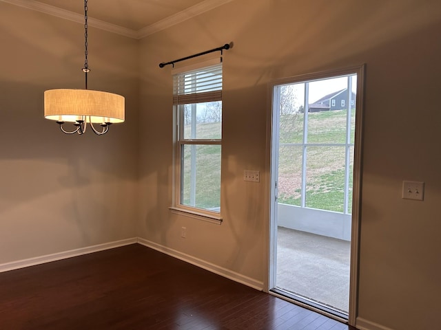 1012 Wooden Gate Dr, Franklin, TN 37064 - unfurnished dining area with dark wood finished floors, a chandelier, baseboards, and crown molding