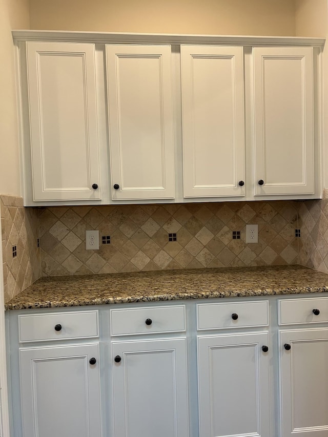 1012 Wooden Gate Dr, Franklin, TN 37064 - kitchen featuring white cabinets, backsplash, and stone countertops