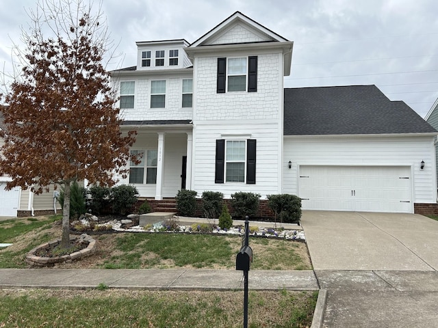 1012 Wooden Gate Dr, Franklin, TN 37064 - view of front of property featuring an attached garage, concrete driveway, and a front lawn