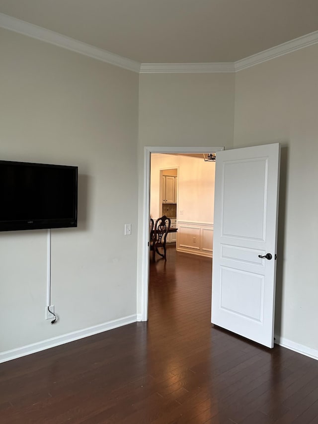 1012 Wooden Gate Dr, Franklin, TN 37064 - empty room featuring crown molding, dark wood-type flooring, and baseboards