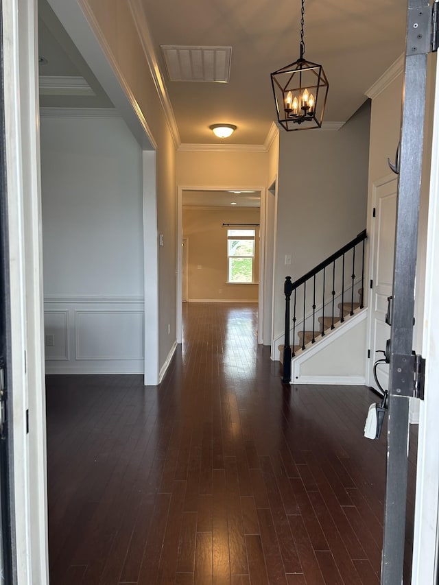 1012 Wooden Gate Dr, Franklin, TN 37064 - foyer entrance featuring a chandelier, stairway, dark wood-style floors, baseboards, and ornamental molding