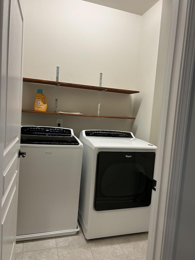 1012 Wooden Gate Dr, Franklin, TN 37064 - laundry room featuring washer and clothes dryer and light tile patterned floors