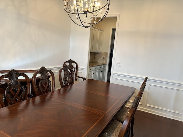 1012 Wooden Gate Dr, Franklin, TN 37064 - dining space with a chandelier, a wainscoted wall, and dark wood-style floors