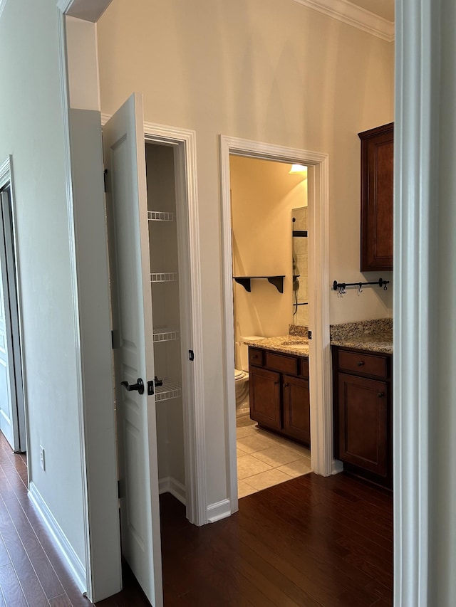 1012 Wooden Gate Dr, Franklin, TN 37064 - corridor with light wood-type flooring, ornamental molding, baseboards, and a sink