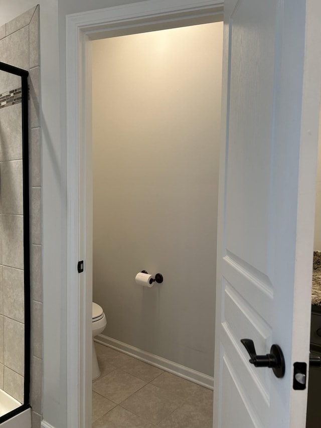 1012 Wooden Gate Dr, Franklin, TN 37064 - full bathroom featuring toilet, a shower stall, tile patterned flooring, and baseboards