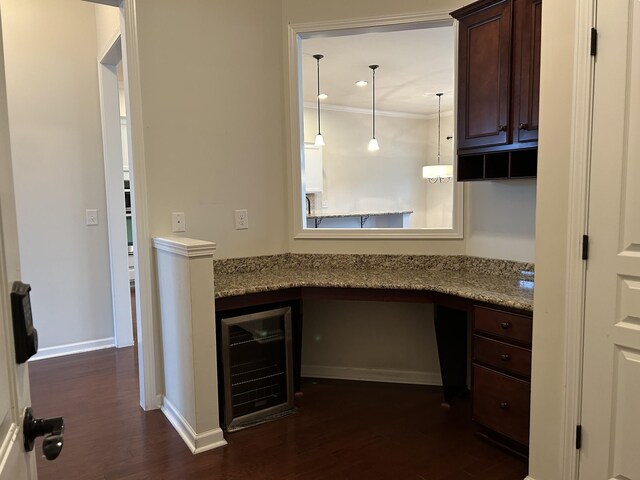 1012 Wooden Gate Dr, Franklin, TN 37064 - unfurnished office with beverage cooler, dark wood-style floors, ornamental molding, built in study area, and baseboards
