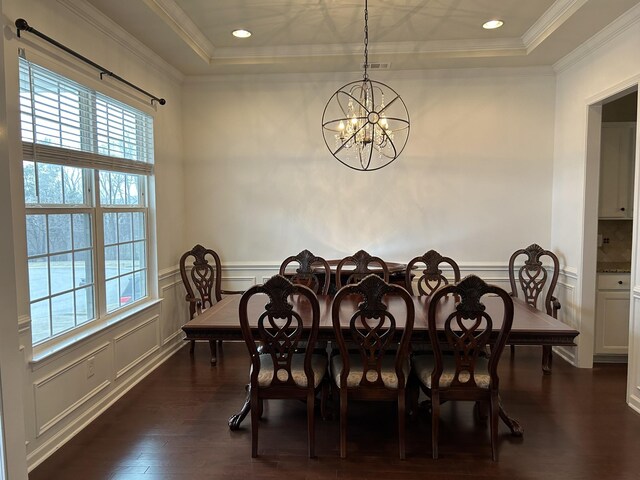 1012 Wooden Gate Dr, Franklin, TN 37064 - dining space featuring a raised ceiling, a chandelier, dark wood finished floors, crown molding, and a decorative wall