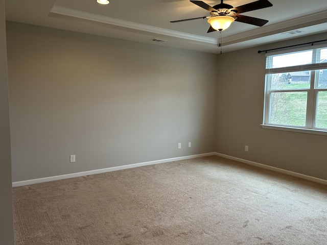 1012 Wooden Gate Dr, Franklin, TN 37064 - empty room with a raised ceiling, carpet floors, baseboards, crown molding, and a ceiling fan