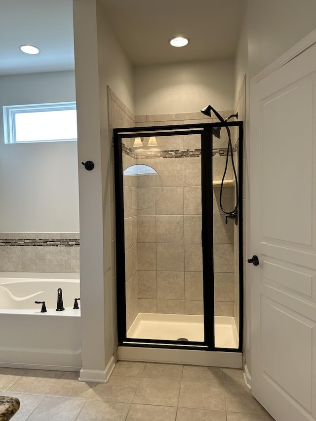 1012 Wooden Gate Dr, Franklin, TN 37064 - bathroom with a stall shower, a bath, tile patterned flooring, and recessed lighting