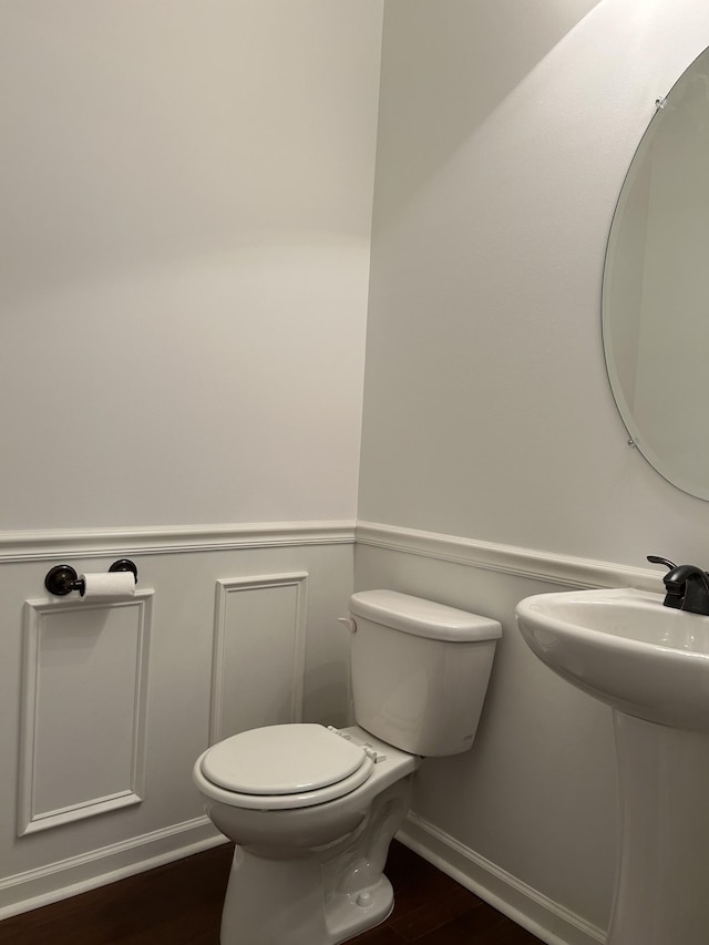 1012 Wooden Gate Dr, Franklin, TN 37064 - half bath with wood finished floors, toilet, baseboards, and a sink
