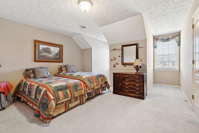 bedroom featuring visible vents, baseboards, carpet, vaulted ceiling, and a textured ceiling