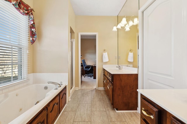 full bathroom with vanity, a shower stall, and a tub with jets