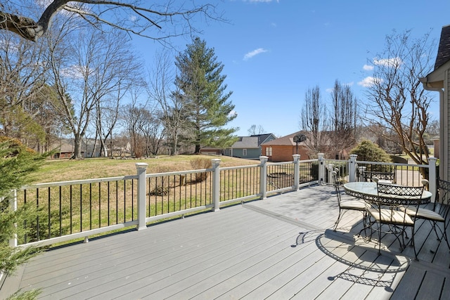 wooden terrace with a yard