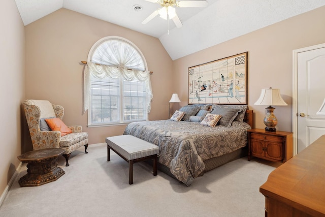 carpeted bedroom featuring lofted ceiling, visible vents, and a ceiling fan