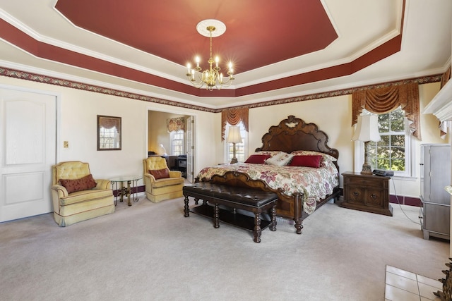 bedroom featuring carpet, a chandelier, a raised ceiling, and crown molding