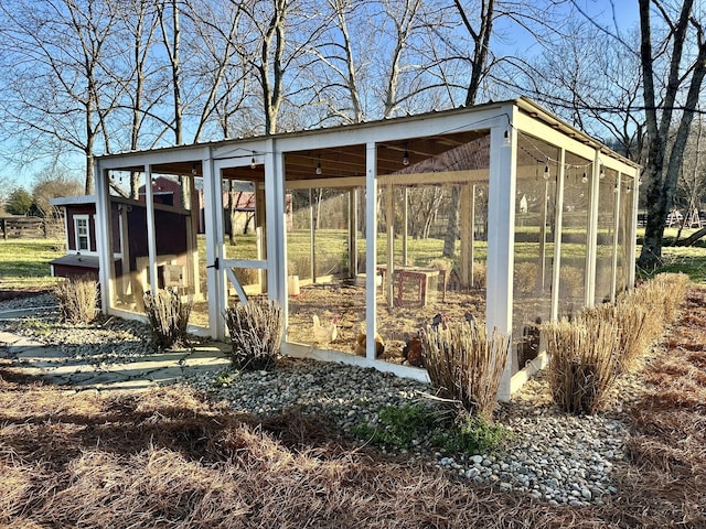 view of poultry coop featuring a carport