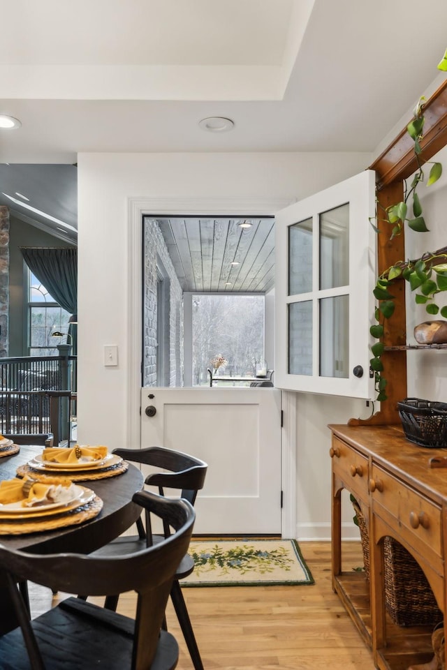 dining space with light wood-type flooring and recessed lighting