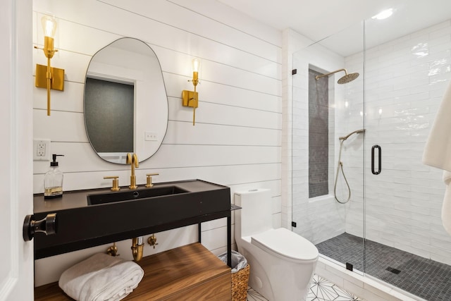 bathroom with a stall shower, vanity, and toilet