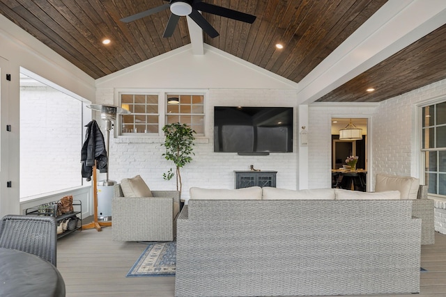 living room featuring lofted ceiling, wooden ceiling, brick wall, and wood finished floors