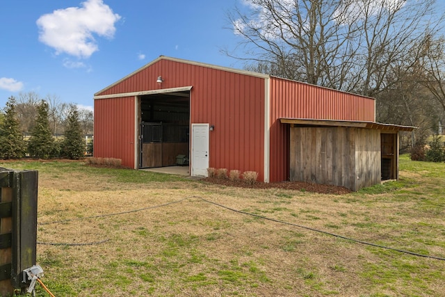 view of pole building with a yard