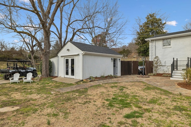 view of outdoor structure featuring french doors and an outdoor structure