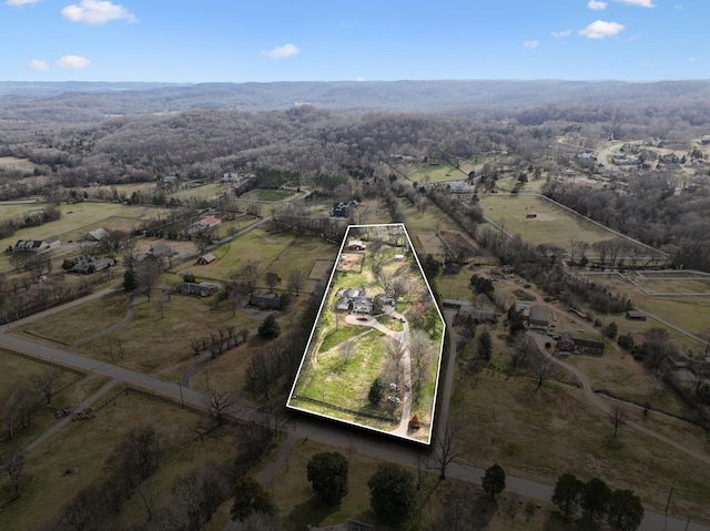 birds eye view of property featuring a rural view