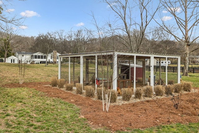 view of poultry coop featuring a yard