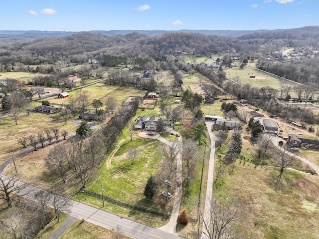 drone / aerial view with a rural view and a wooded view