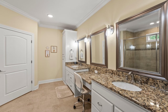 bathroom featuring baseboards, tiled shower, ornamental molding, tile patterned floors, and vanity