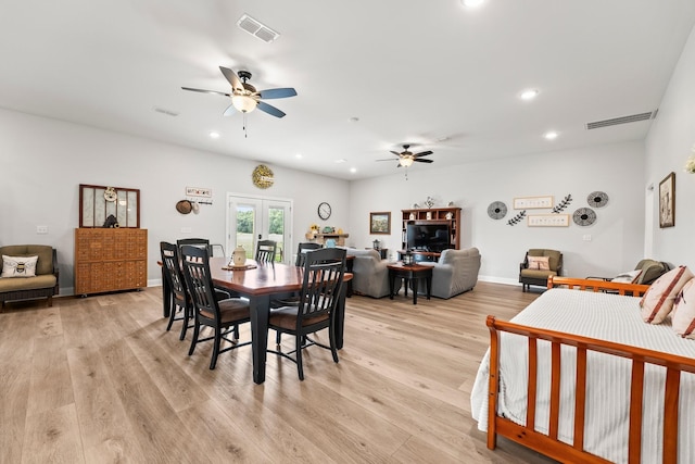 dining room with light wood-style floors, visible vents, french doors, and recessed lighting