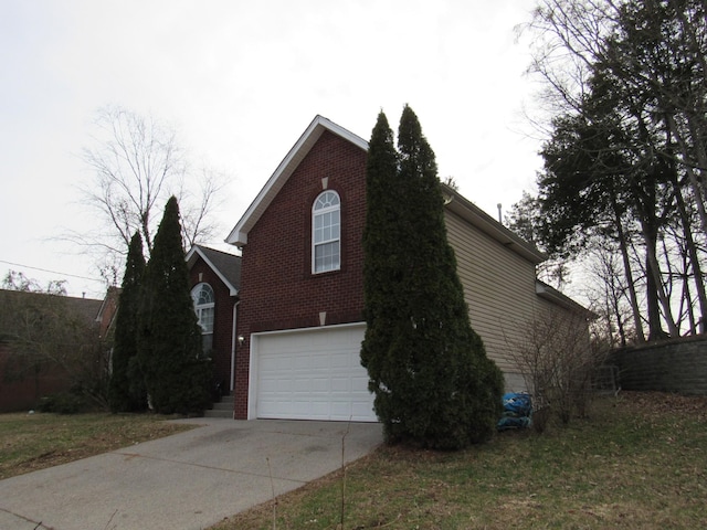 view of home's exterior with a garage, concrete driveway, and brick siding