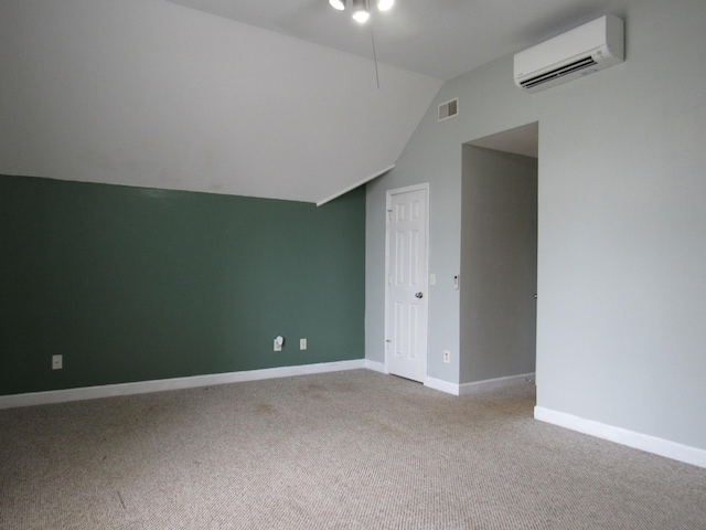 bonus room with lofted ceiling, visible vents, baseboards, an AC wall unit, and carpet