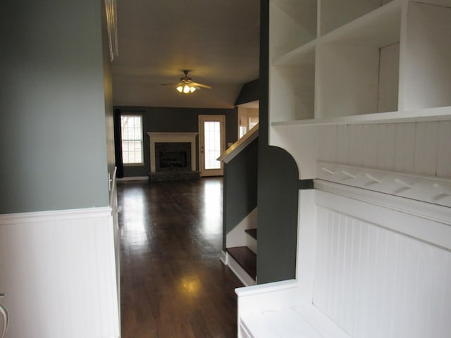 hallway with dark wood-type flooring and stairway