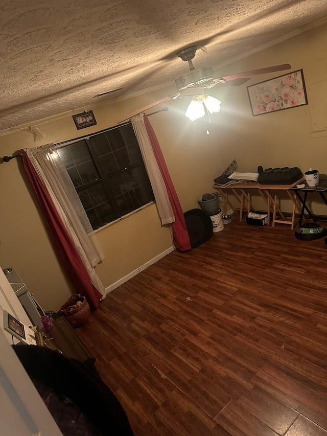 interior space featuring a textured ceiling and wood finished floors