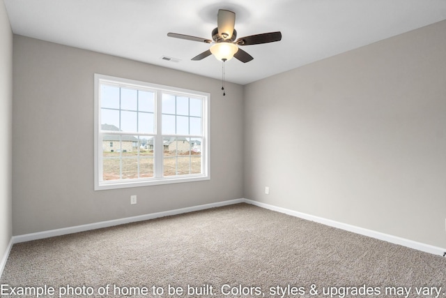 carpeted spare room with ceiling fan, visible vents, and baseboards