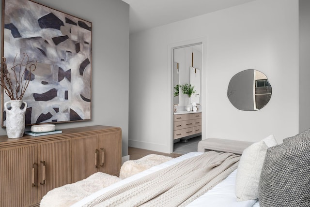 bedroom featuring tile patterned flooring and baseboards