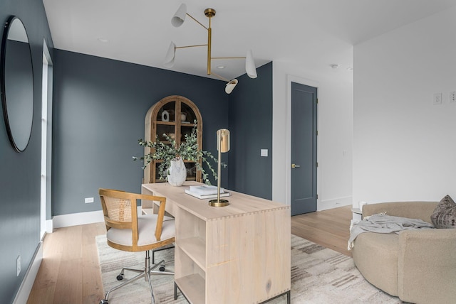 interior space with light wood-style flooring and baseboards