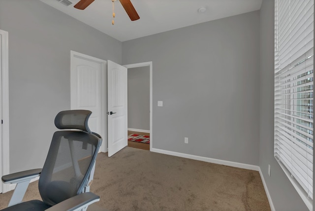 home office with visible vents, baseboards, and carpet flooring