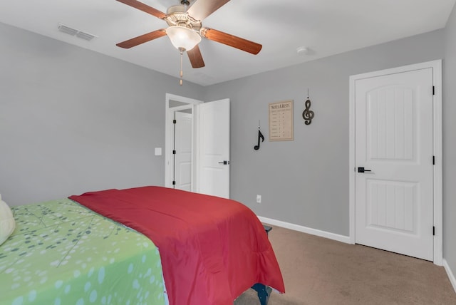 bedroom with a ceiling fan, carpet flooring, visible vents, and baseboards