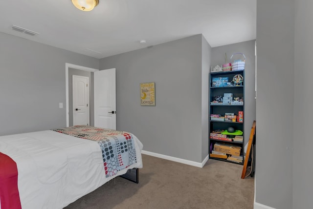 bedroom featuring carpet floors, baseboards, and visible vents