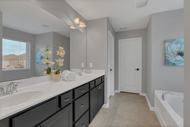 full bath with visible vents, a sink, and baseboards