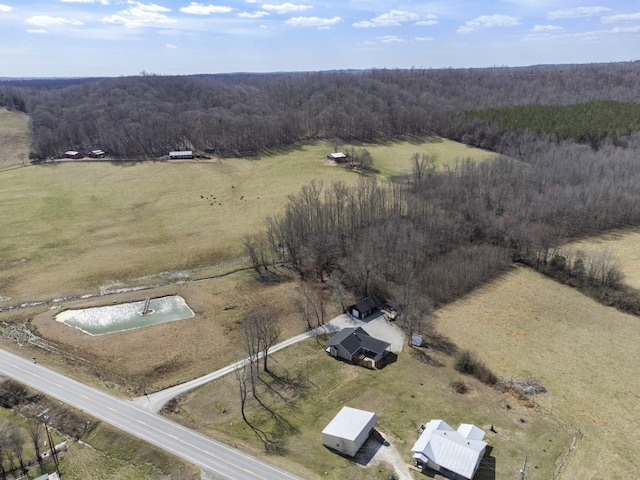 bird's eye view with a rural view and a view of trees