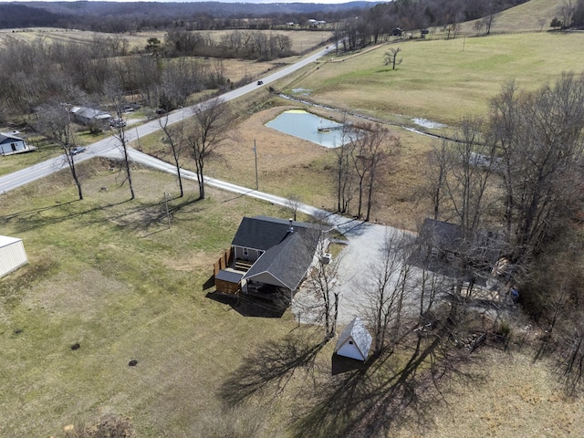 aerial view with a rural view and a water view