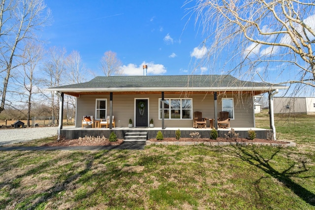 view of front of property featuring covered porch and a front lawn