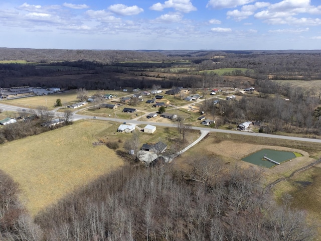 birds eye view of property with a rural view