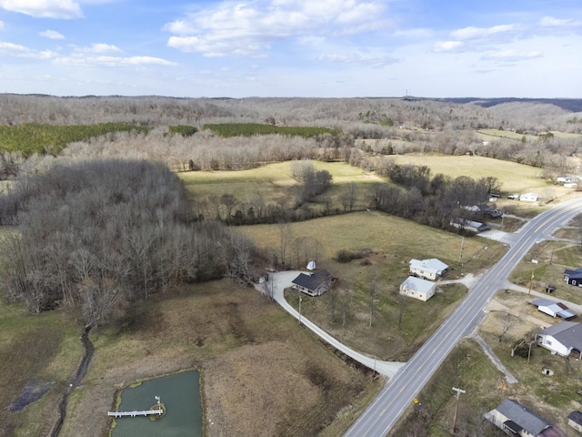 birds eye view of property with a rural view